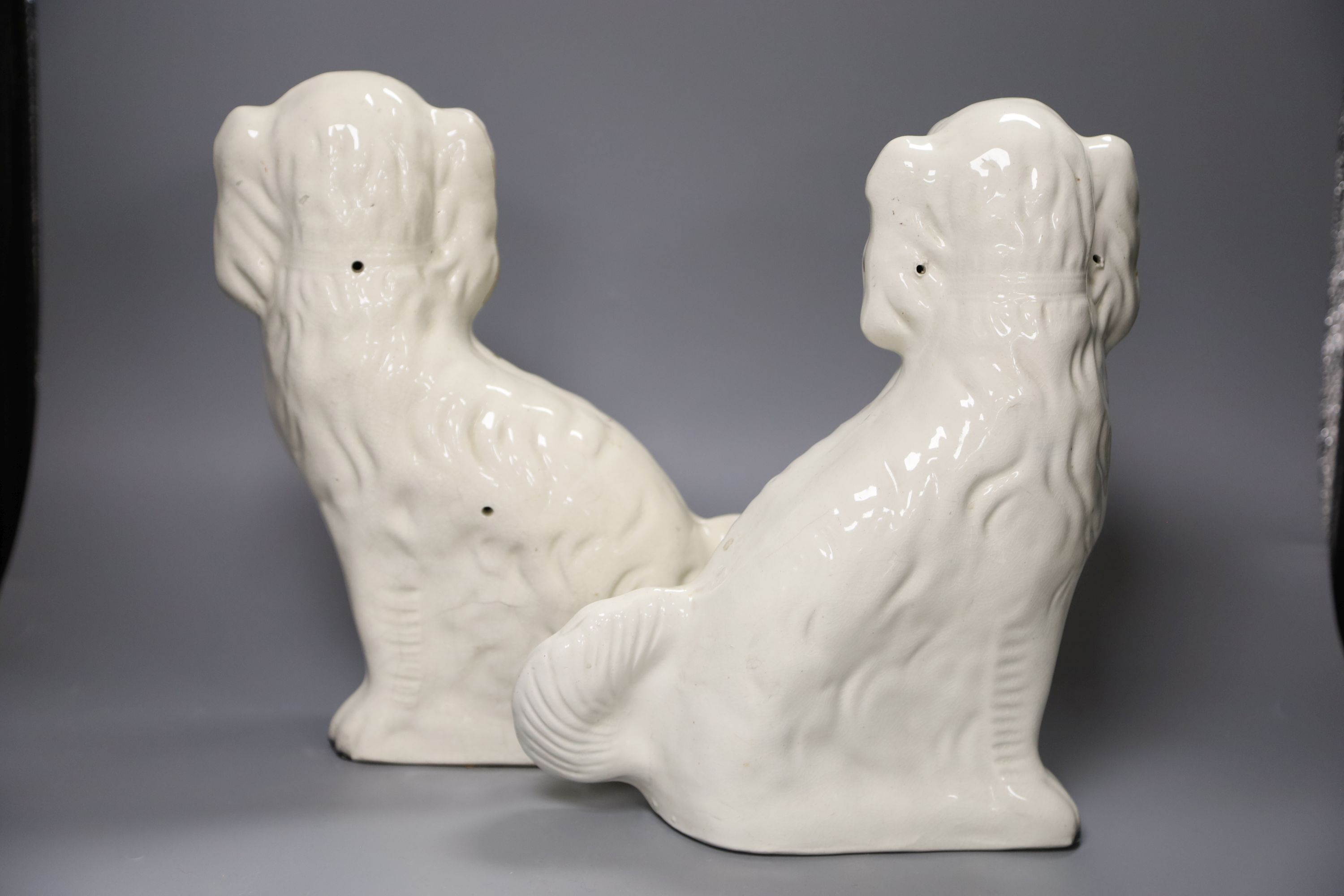 Two pairs of 19th century Staffordshire King Charles Spaniels, height 31cm